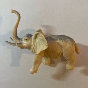 Beige and grey elephant figure toy